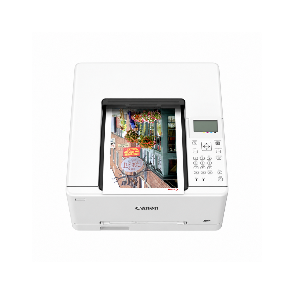 White Canon i-SENSYS LBP646Cdw color laser printer, top view with a color print in the output tray.
